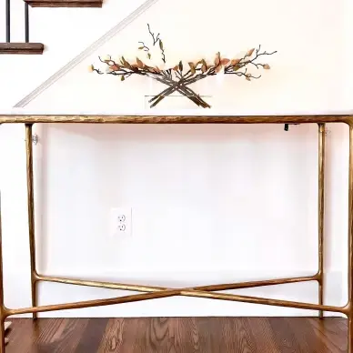 Console table secured with anti-tip resistant tethers