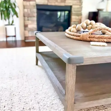 Coffee table with gray corner cushions