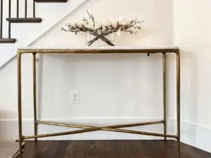 Blog 2 Designer child proofing on an entry table with tip resistant furniture tethers.