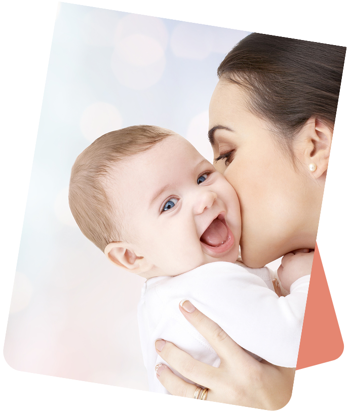 Mother holding baby, soft background.